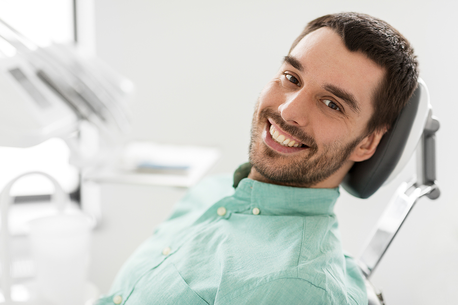 medicine, dentistry and healthcare concept – happy smiling male