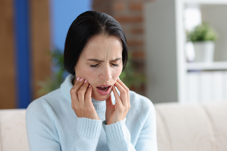 Woman With Severe Acute Toothache. Dental Problem And Caries Tre