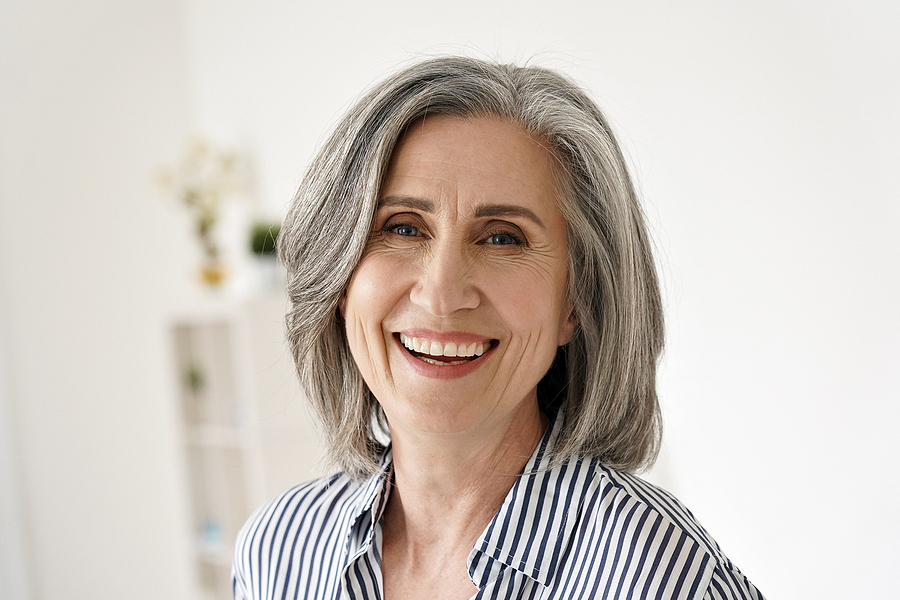 Cheerful Satisfied 50s Mature Woman Laughing Looking At Camera A